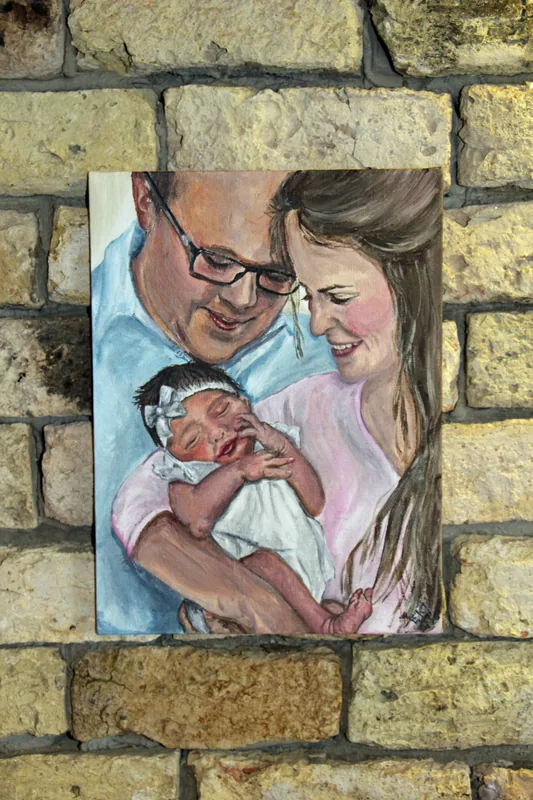 Painting by Emily K. Joynt of parents holding their newborn